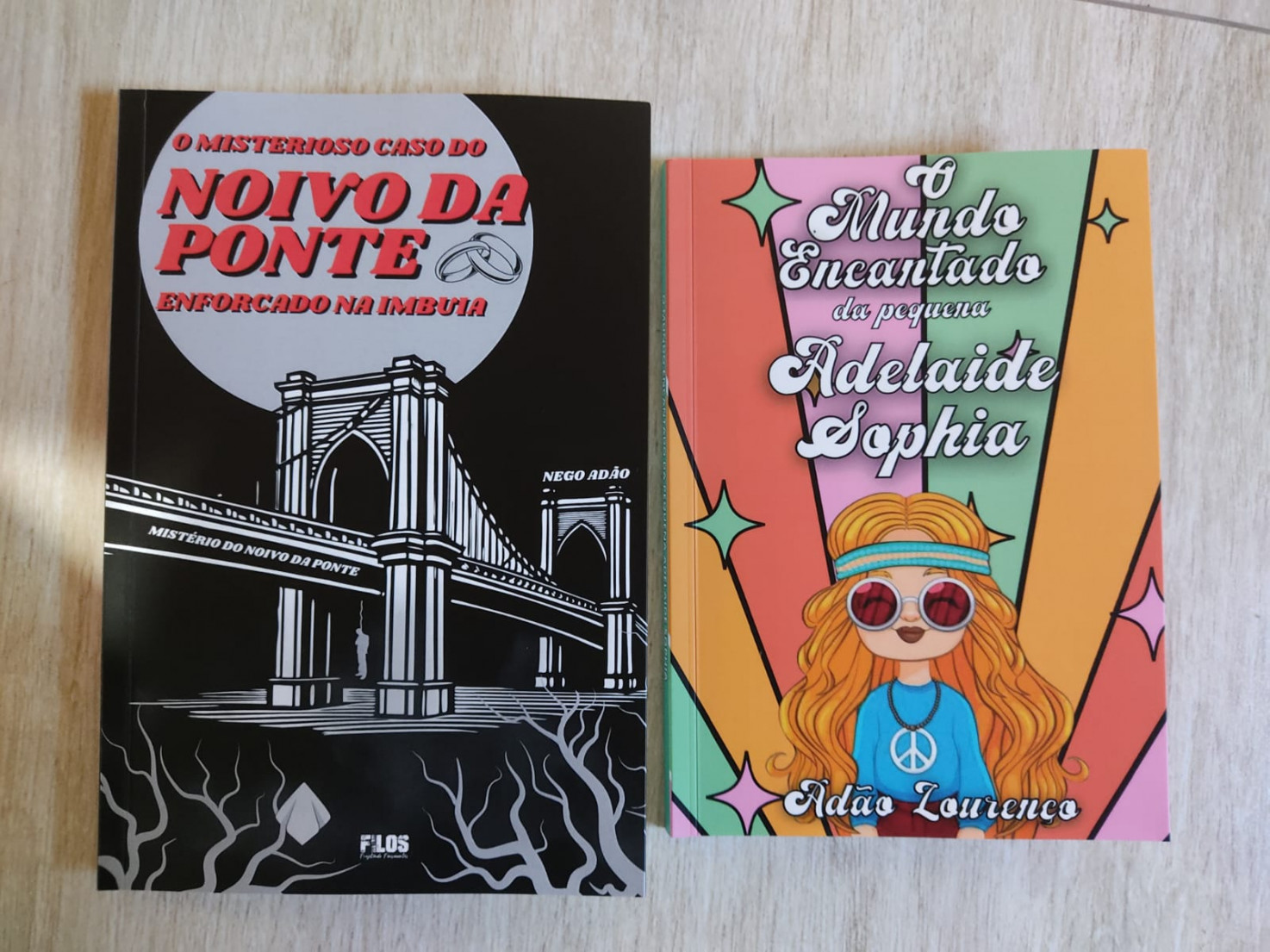 Esses dois, consideram minhas obras primas. Há 30 anos estou escrevendo. Noivo da ponte para se contrapor a noiva da ponte. Adelaide Sophia, uma história infantil.