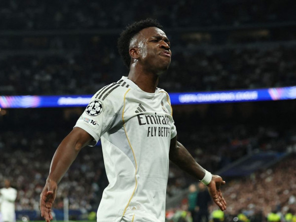 Vini Jr brilha e ajuda Real a despachar Benfica na Liga dos Campe&otilde;es